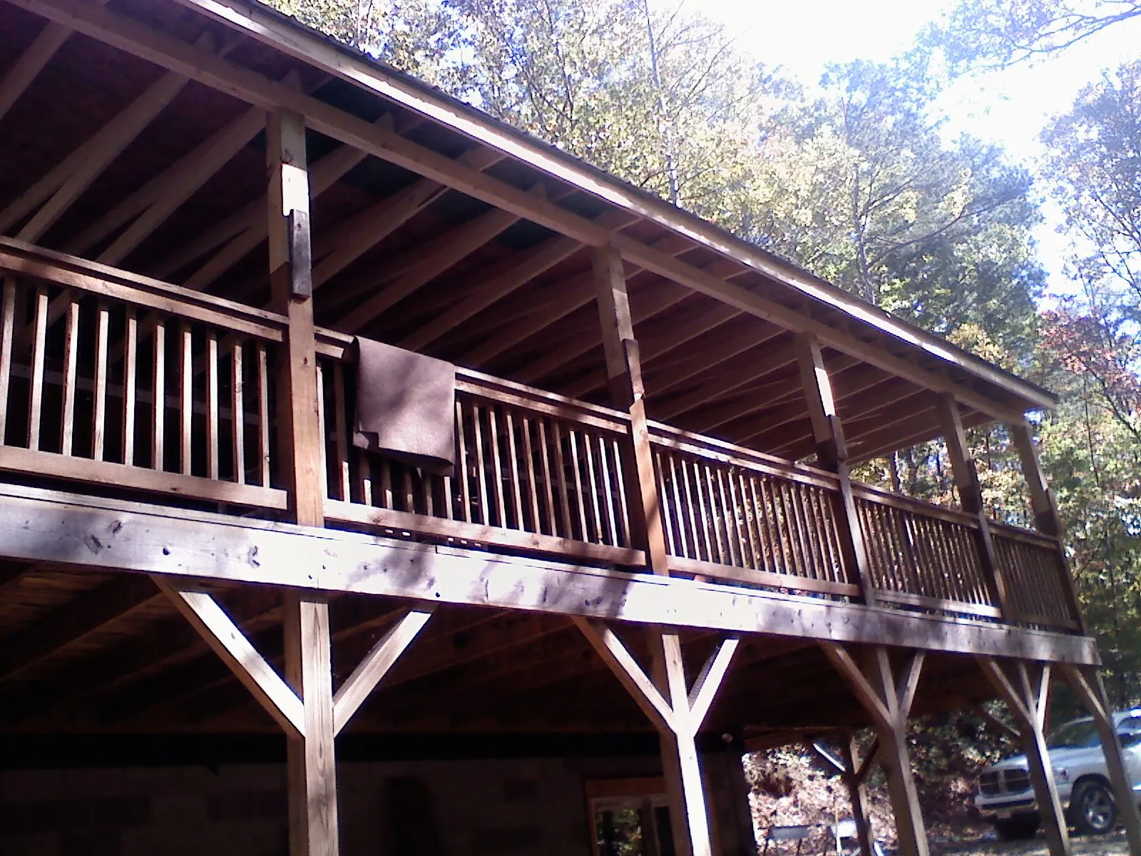 Timber framing under a new elevated porch and deck — Roof Leak Repair in Toney by Roofing Brothers